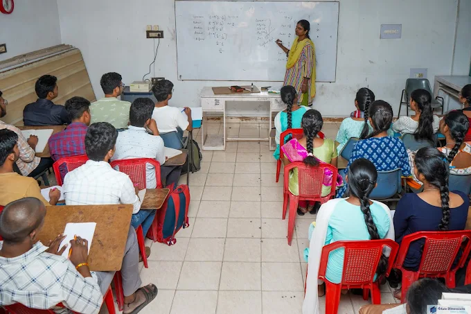 Faculty teaching engineering mathematics on whiteboard